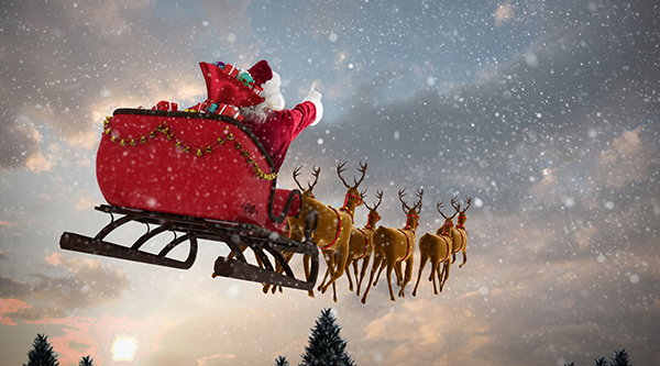 Tomte som åker släde