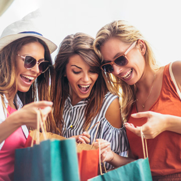 Three girls having fun whilst shopping